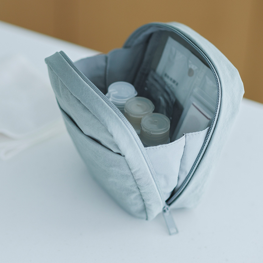 Beauty accessories arranged on a clean neutral surface