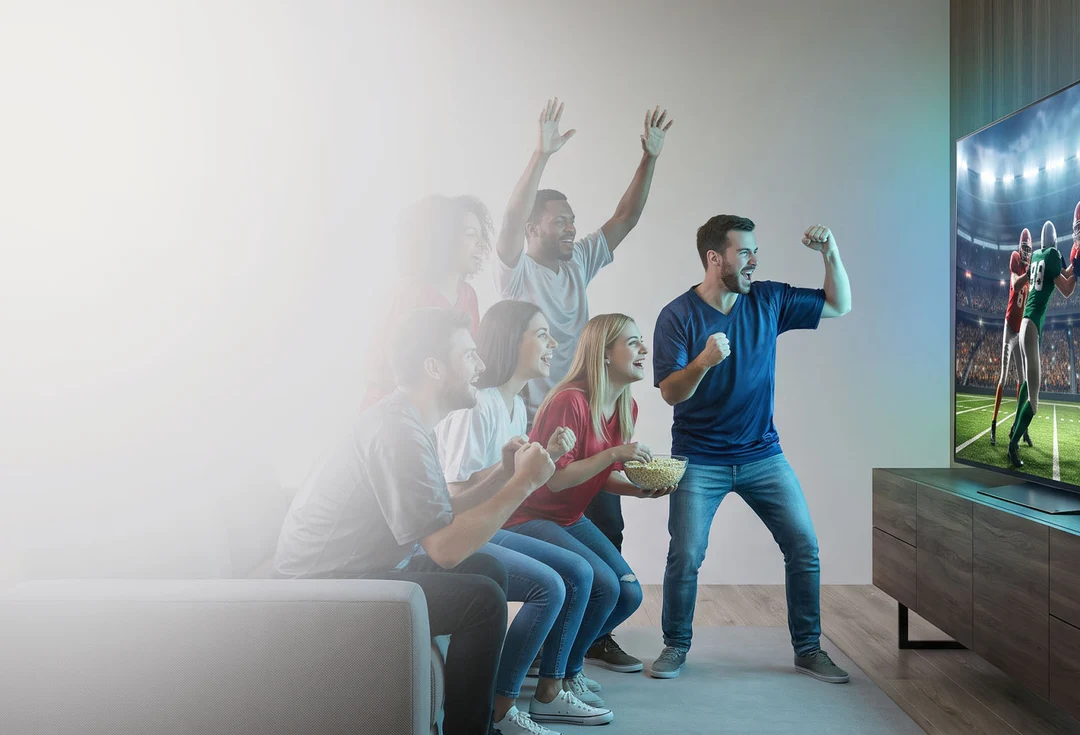 Football season promotional scene centered on a television in a living room