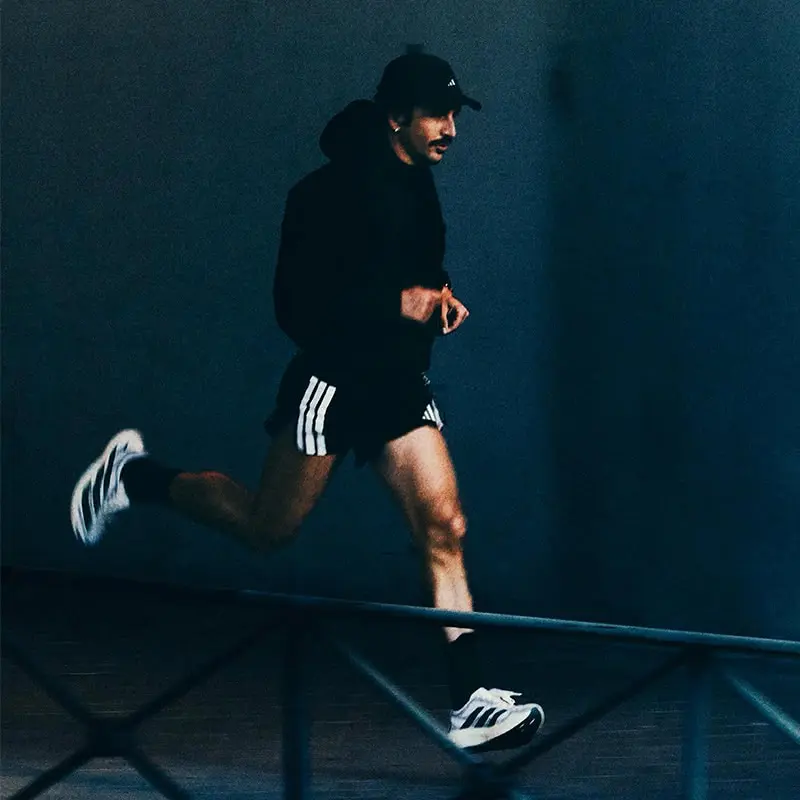 Adidas running shoes and sports apparel display