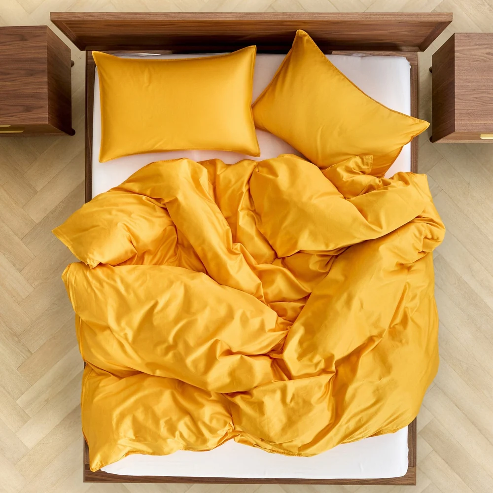 Bedding arranged on a bed, viewed from above